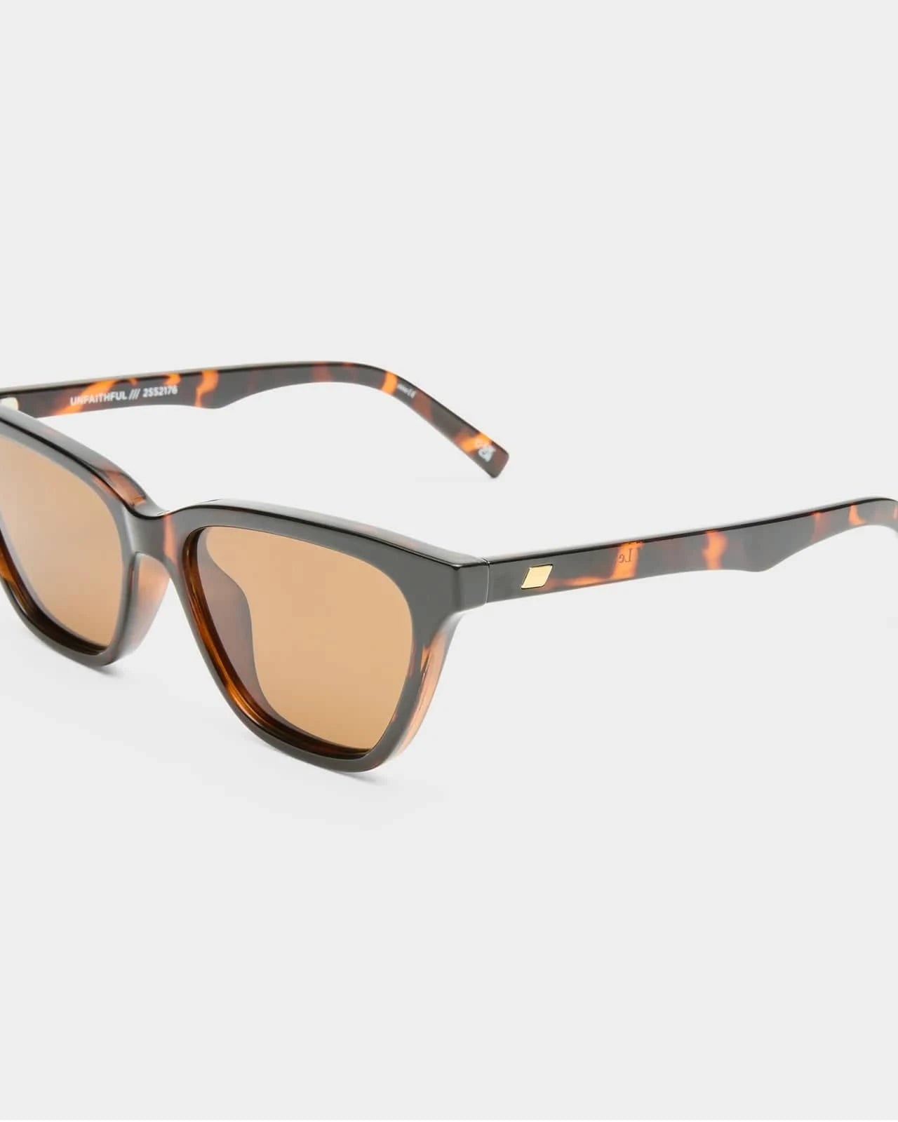 Le Specs Unfaithful Sunnies - Tort LSP2552176 Le Specs Unfaithful Sunnies - Black Splash Swimwear Sunglasses 9324976428332