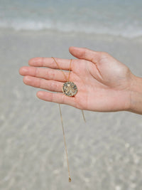 Malakai The Label Sand Dollar Necklace - Gold CCE-902-GLD Sand Dollar Necklace - Gold Splash Swimwear Accessories 79944611